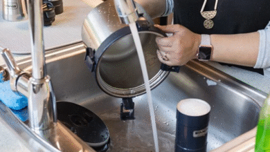 How do I clean stainless steel containers properly?